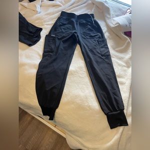 Scrubs!! Tops are XS. Bottoms are S petite. Brand is Landau.